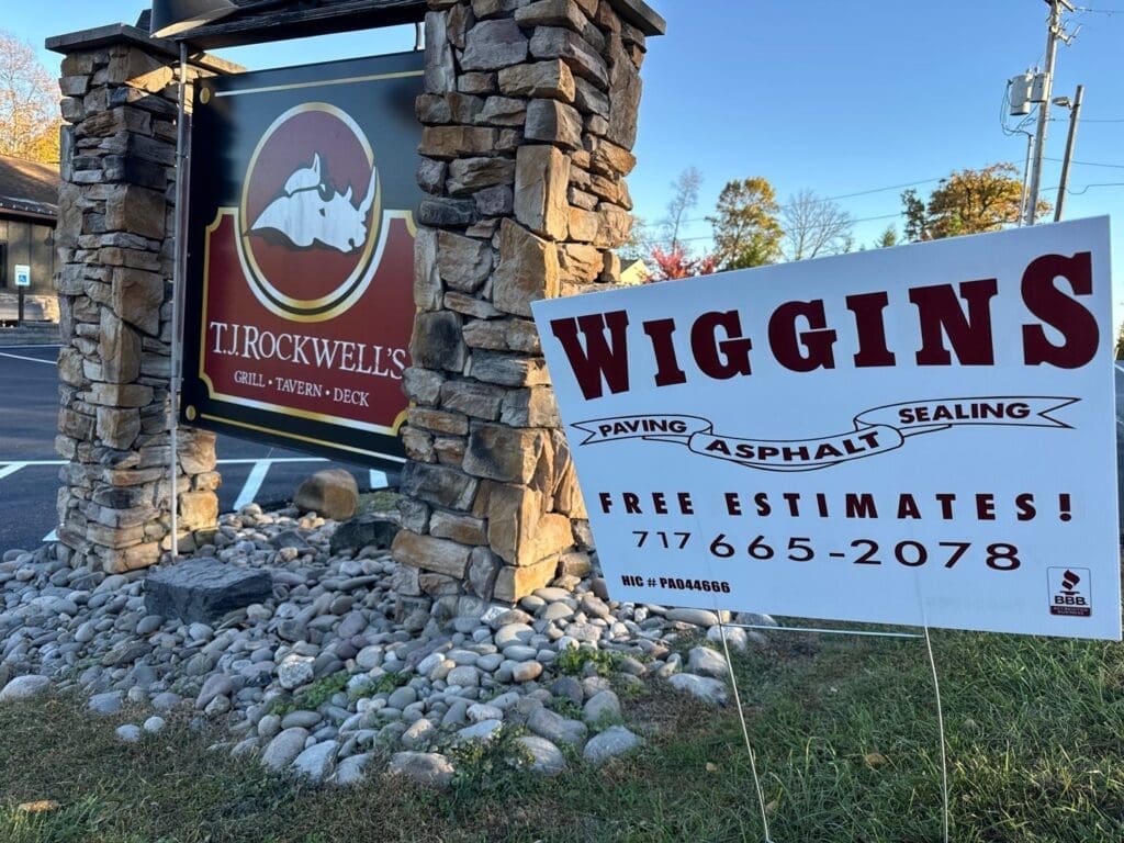 a sign showing sealcoating done at TJ Rockwells
